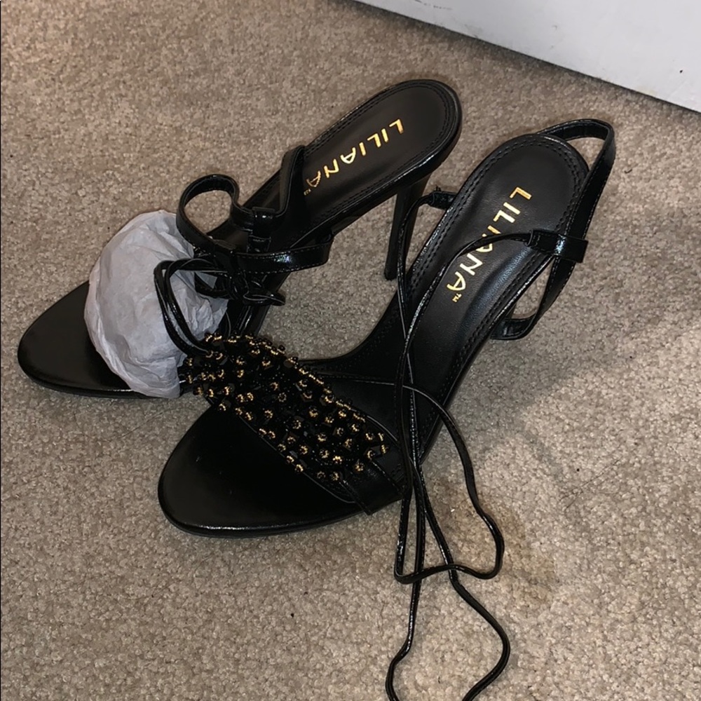 Beaded black and gold tie up heel, never worn.